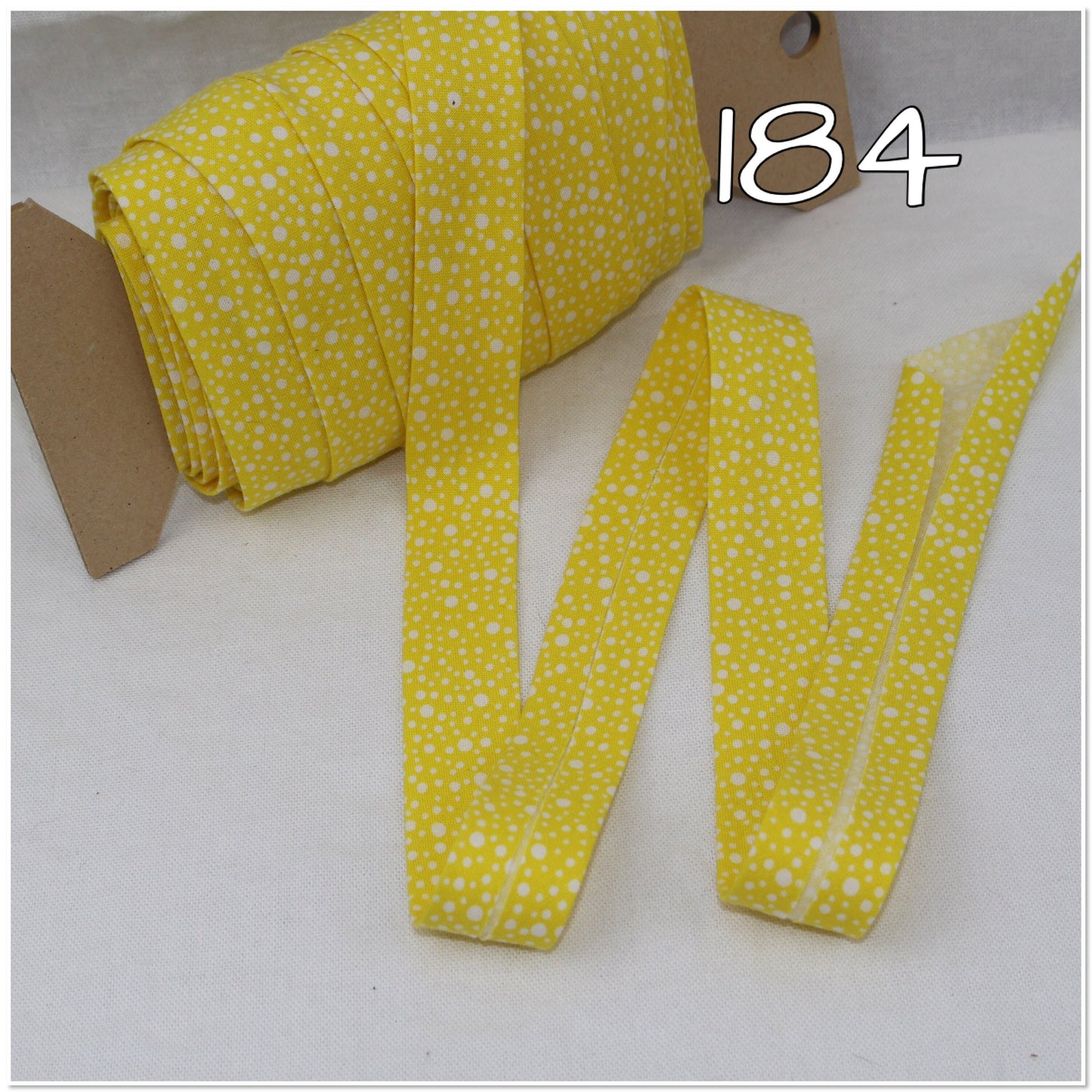 Bias Binding (Tape) 25mm, Cotton, Single Fold, yellow pattern. Fusible iron on available.