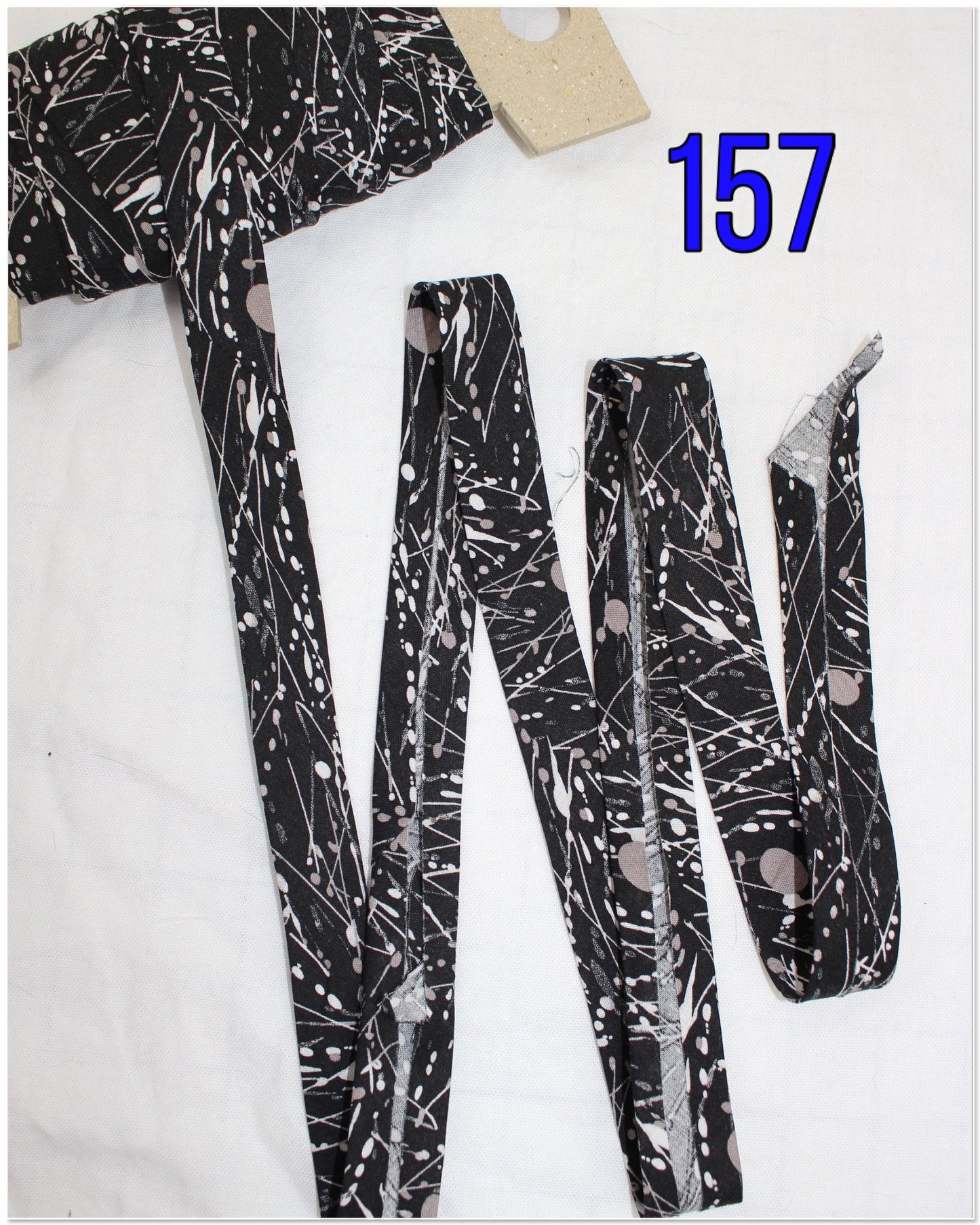 Bias Binding (Tape) 25mm, Cotton, Single Fold. Fusible iron on available. swirls, splats and wavey lines.