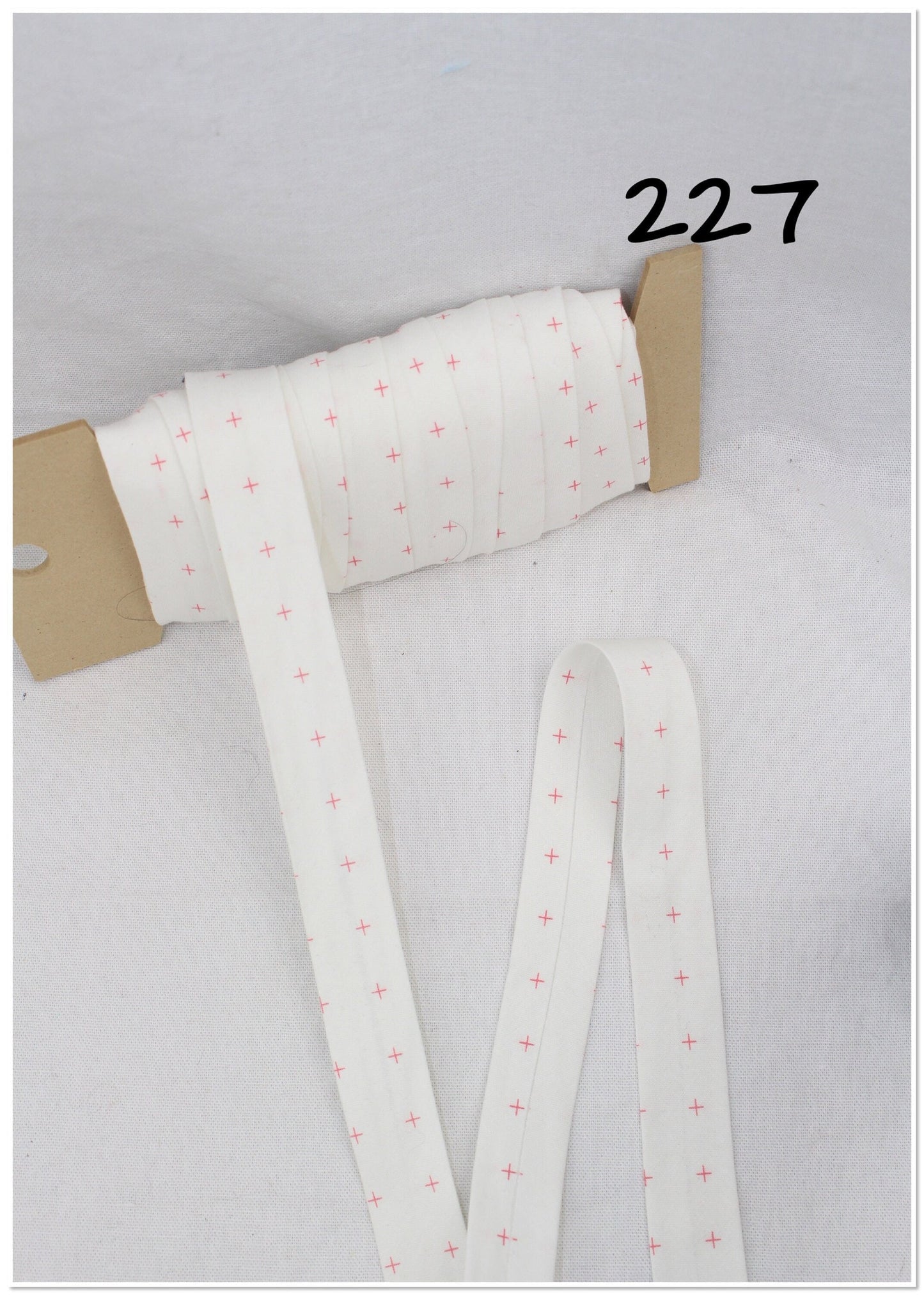 Bias Binding (Tape) 25mm, Cotton, Single Fold, white and crosses. Fusible iron on available.