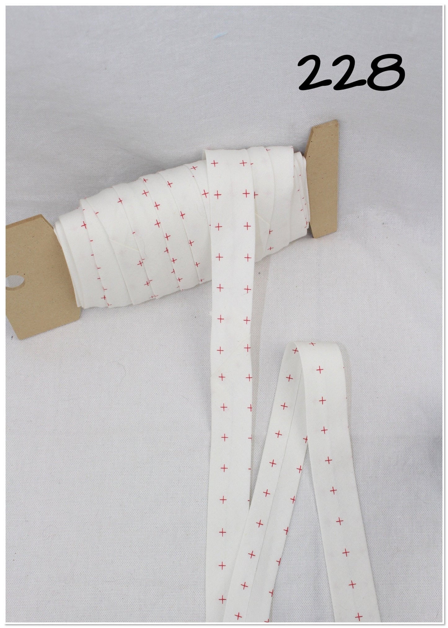 Bias Binding (Tape) 25mm, Cotton, Single Fold, white and crosses. Fusible iron on available.