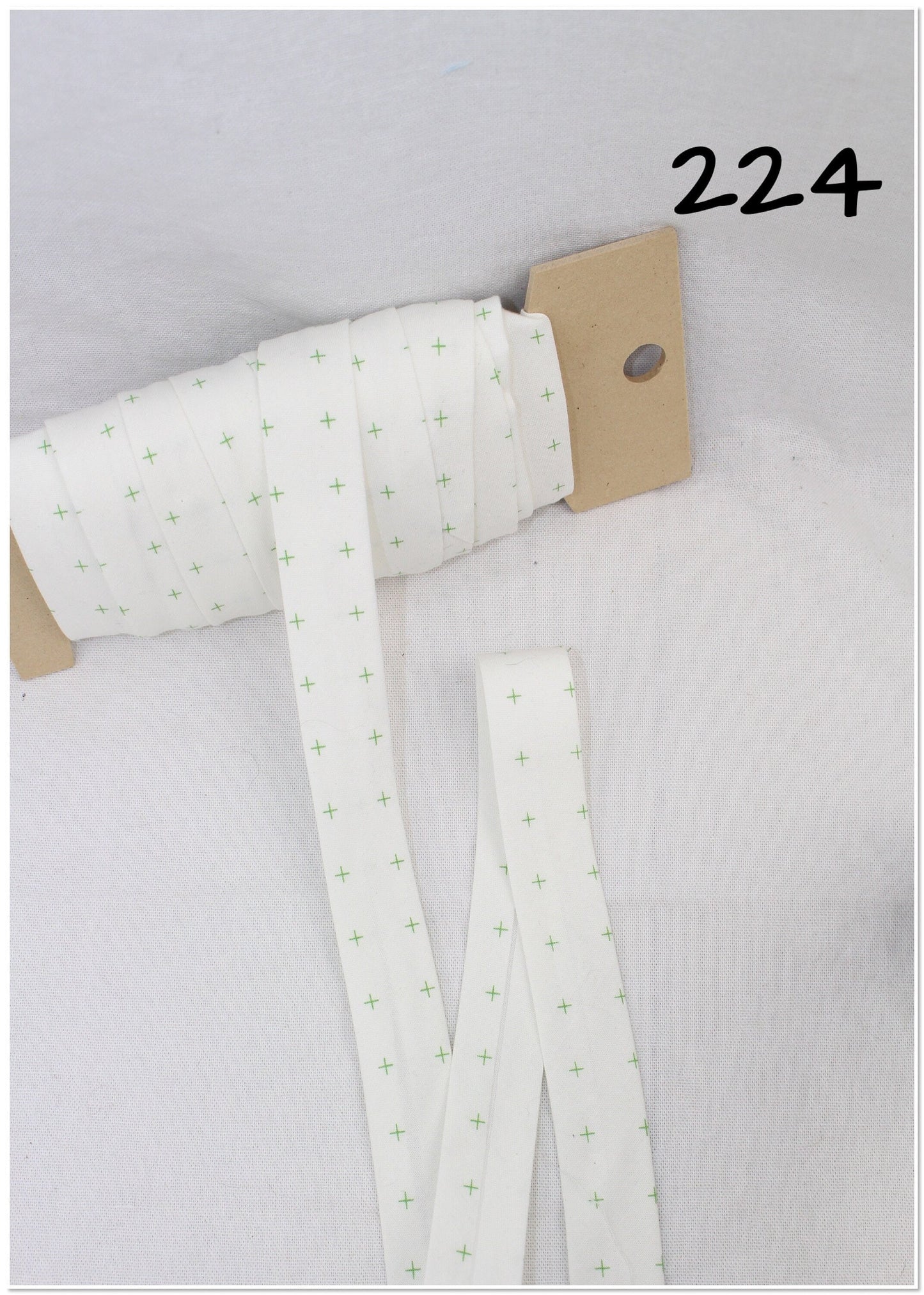 Bias Binding (Tape) 25mm, Cotton, Single Fold, white and crosses. Fusible iron on available.