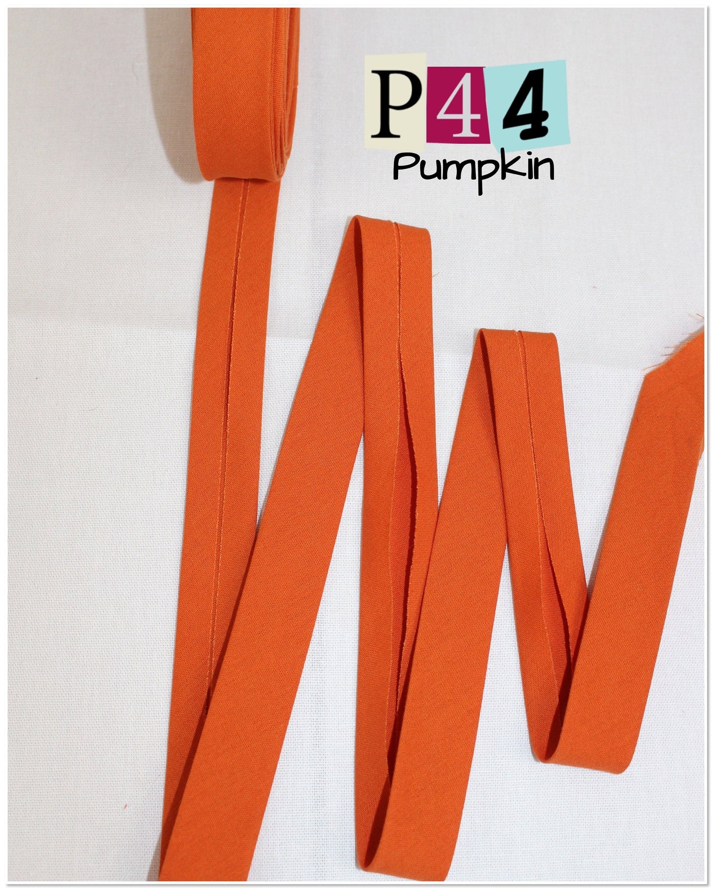 Bias Binding (tape) 25mm or 12mm, single fold, 100% Cotton. coral, orange, pumpkin, sienna. Fusible iron on available.