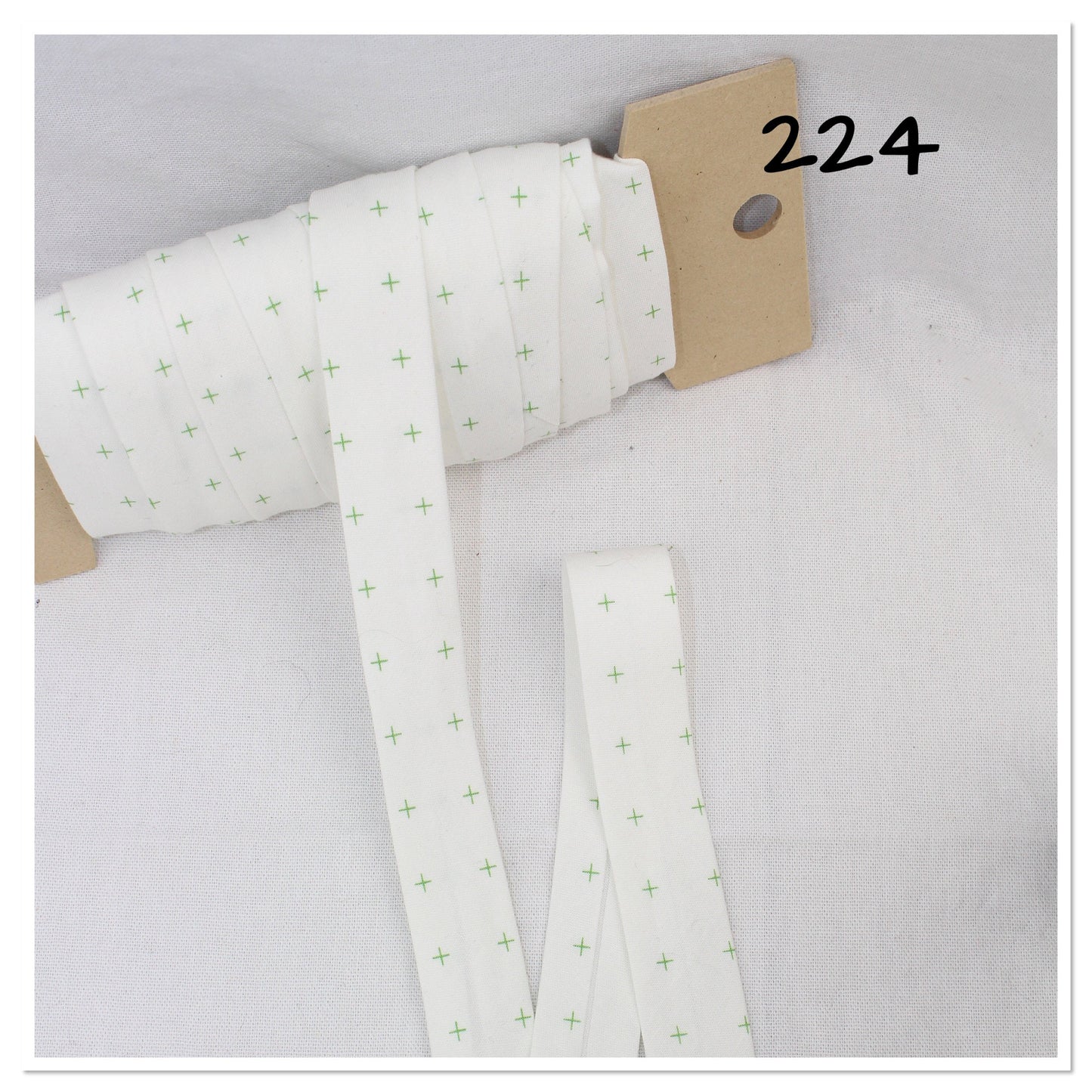 Bias Binding (Tape) 25mm, Cotton, Single Fold, white and crosses. Fusible iron on available.