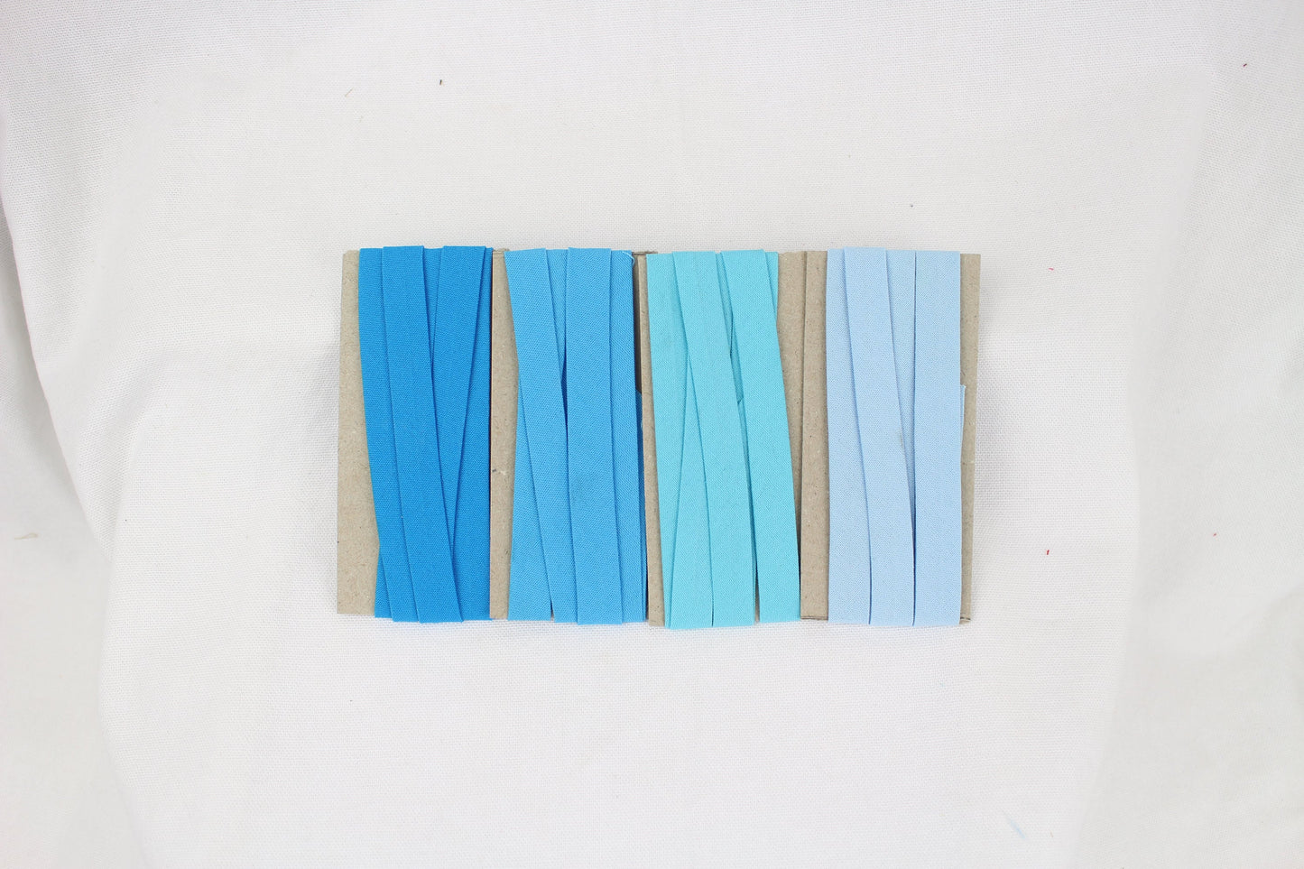 Bias Binding (tape) 12mm, single fold. Marine, sky, sea, bluebell. Fusible iron on available. 100% Cotton