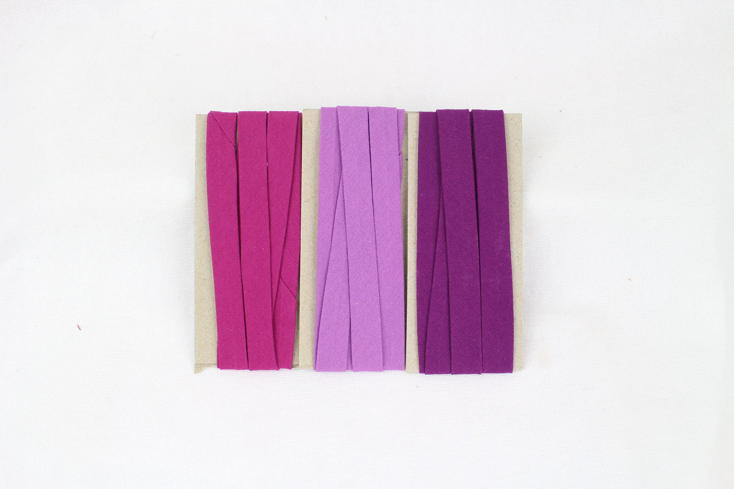 Bias Binding (tape) 12mm, single fold. Lipstick, orchid, grape. Fusible iron on available. 100% Cotton