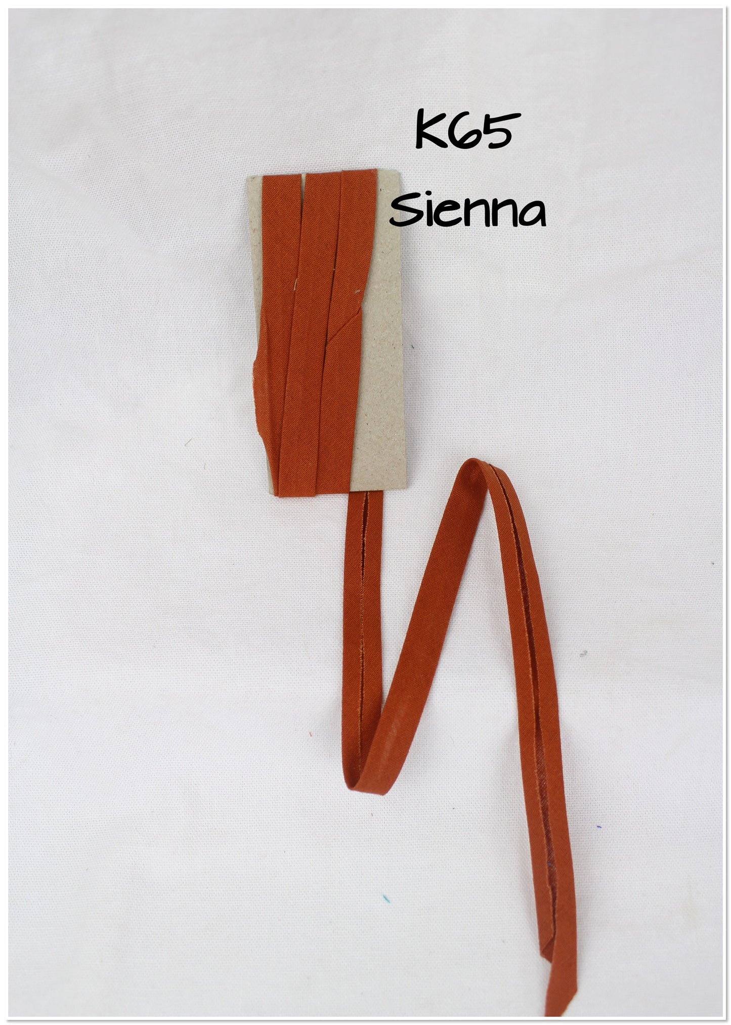 Bias Binding (tape) 25mm, single fold. Pumpkin, butterscotch, sienna. Fusible iron on.