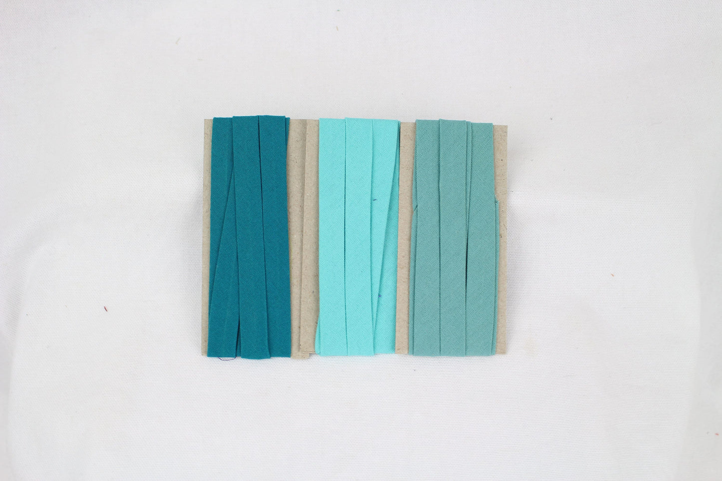 Bias Binding (tape) 12mm, single fold, Cambridge, teal, sea. Fusible iron on available. 100% Cotton.