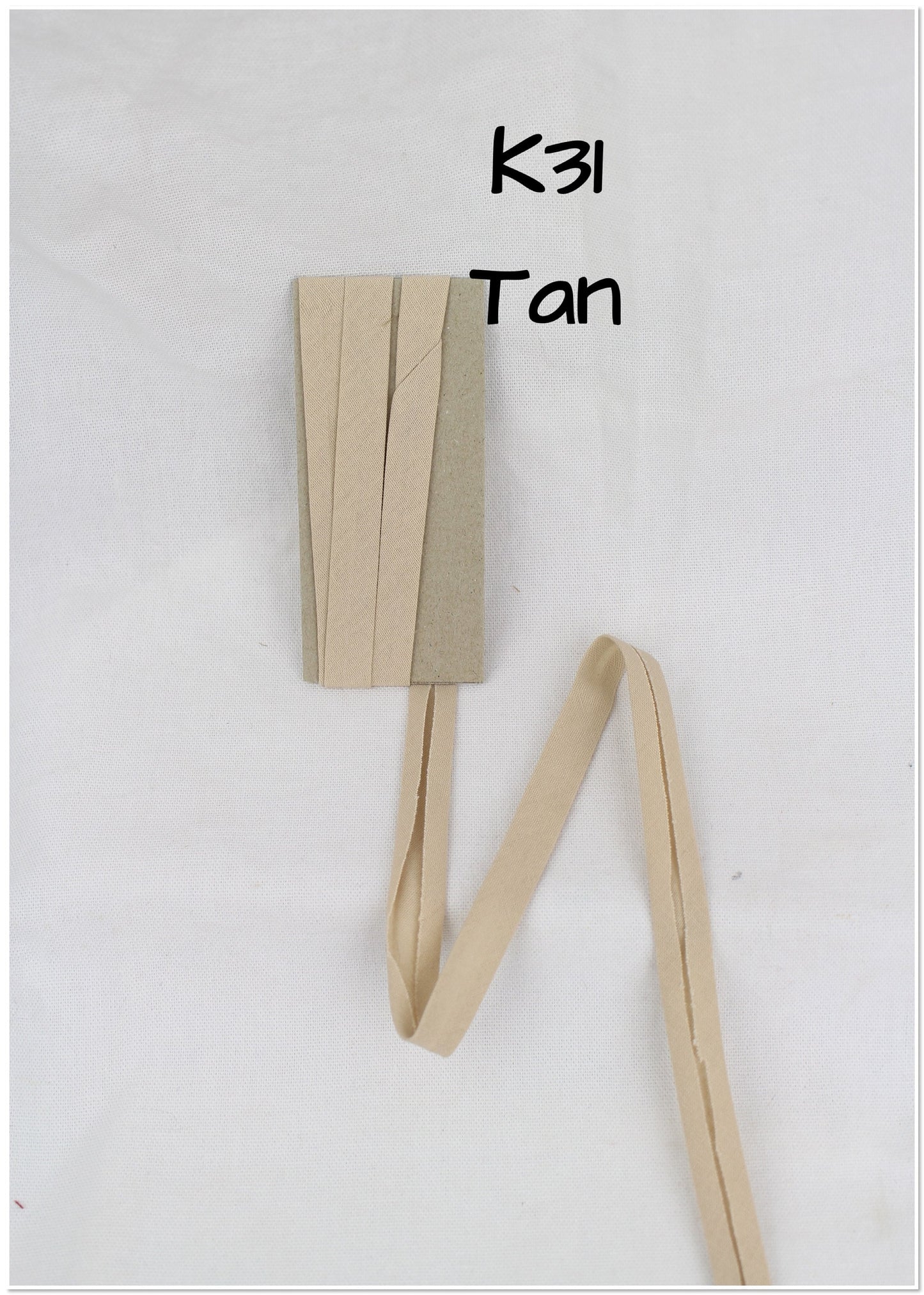 Bias Binding (tape) 12mm, single fold. Dune, doeskin, tan. Fusible iron on available. 100% Cotton