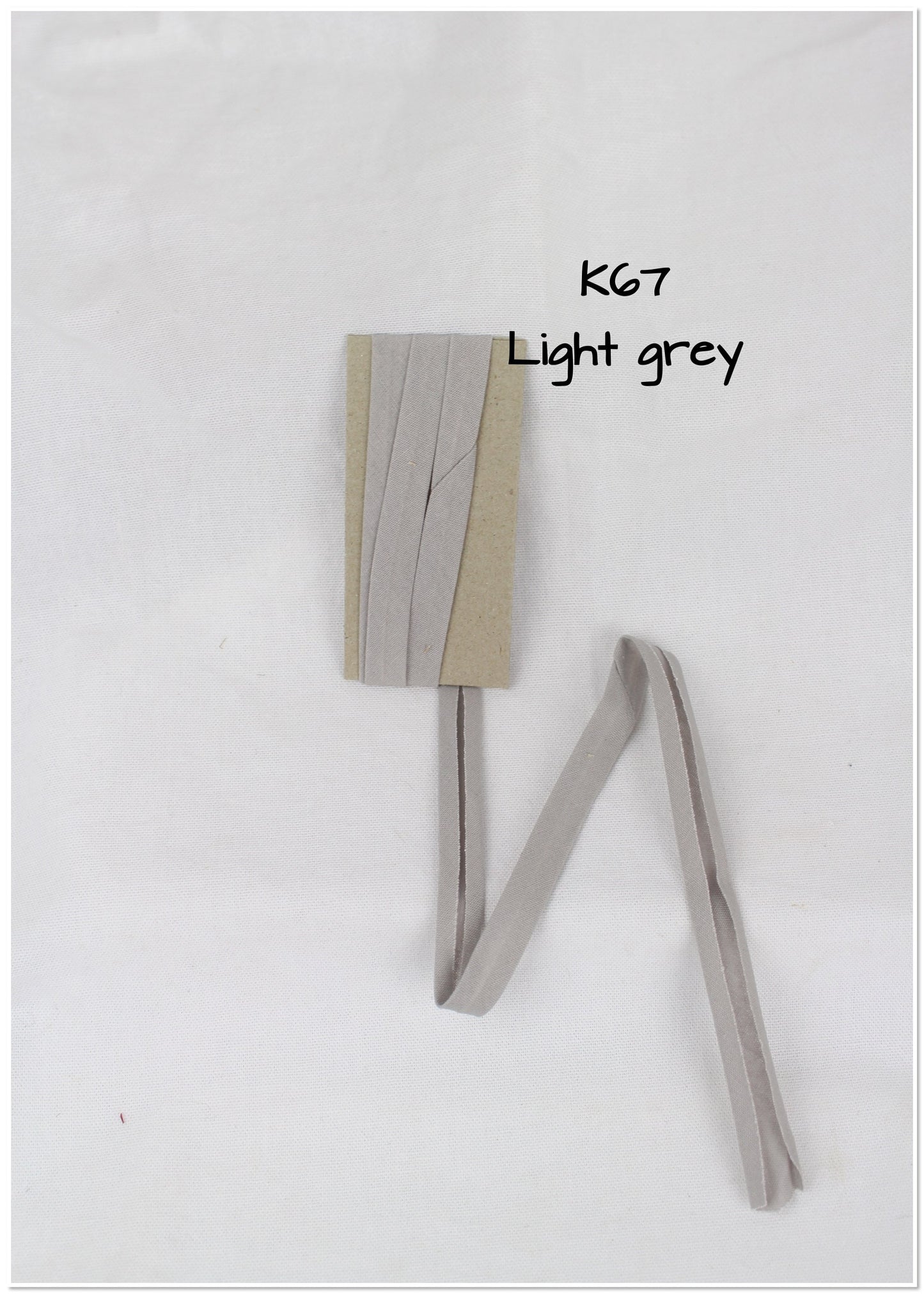 Bias Binding (tape) 12mm, single fold. Neutral grey, iron, light grey. Fusible iron on available. 100% Cotton