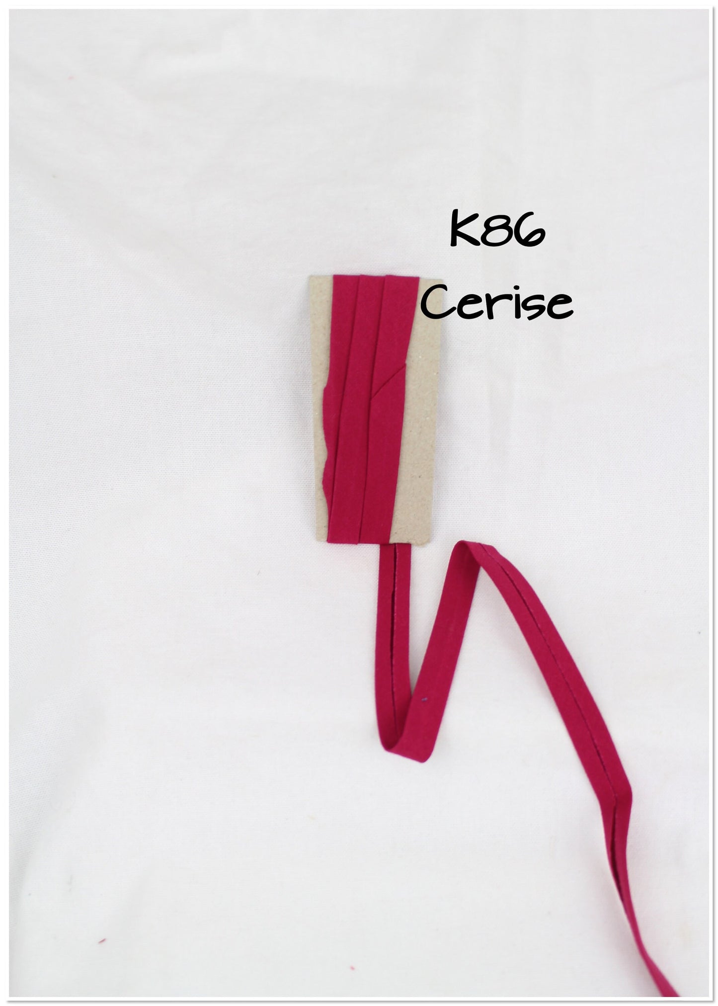 Bias Binding (tape) 25mm, single fold. Cerise, bright rose, rumba red, crimson. Fusible iron on available. 100% Cotton