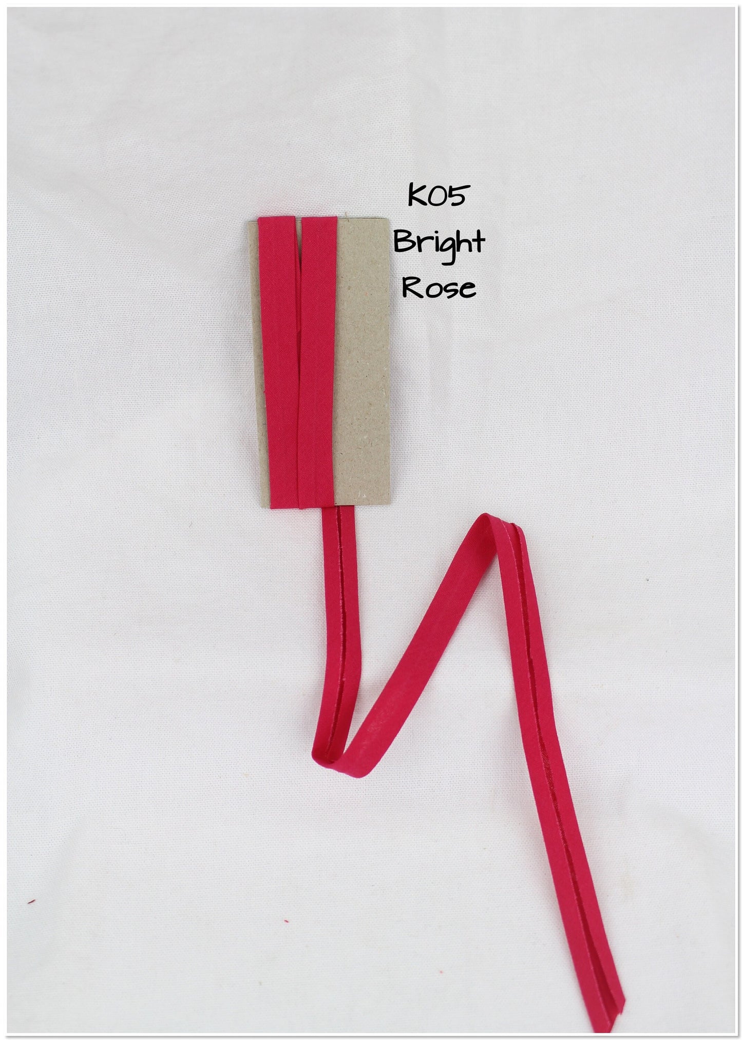 Bias Binding (tape) 25mm, single fold. Cerise, bright rose, rumba red, crimson. Fusible iron on available. 100% Cotton