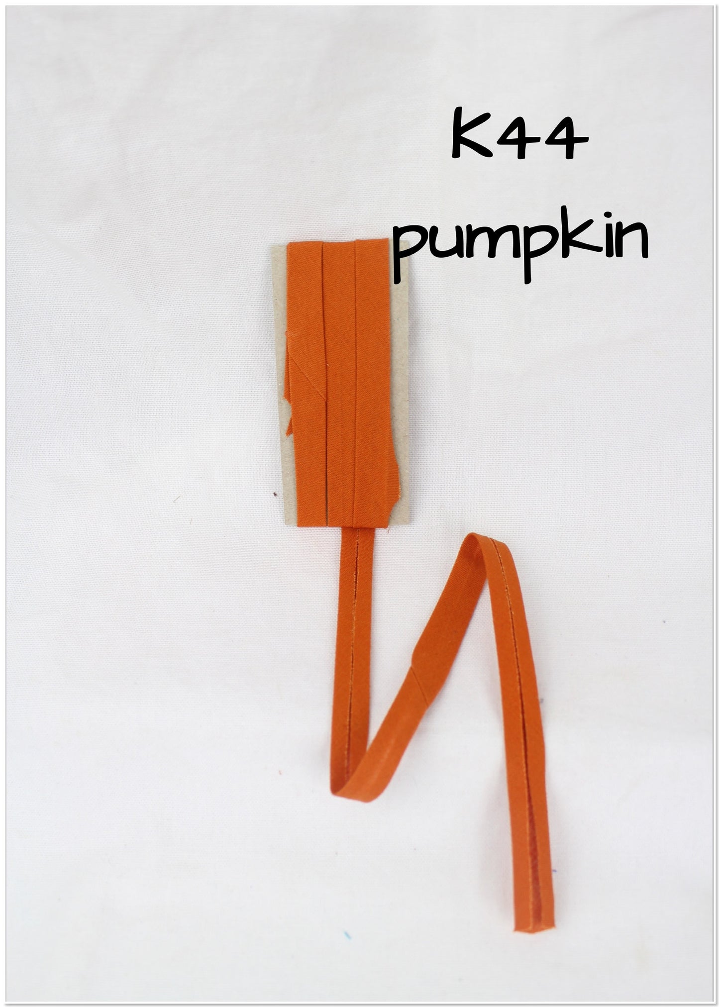 Bias Binding (tape) 25mm, single fold. Pumpkin, butterscotch, sienna. Fusible iron on.