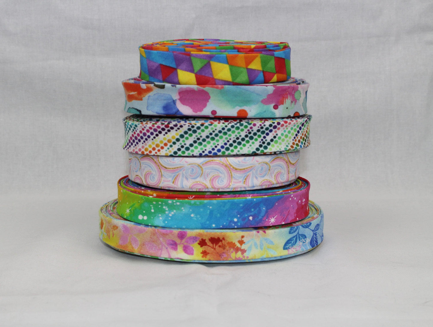 Bias Binding (Tape) 25mm, Cotton, Single Fold. Fusible iron on available. watercolour, rainbow, colourful, swirls.