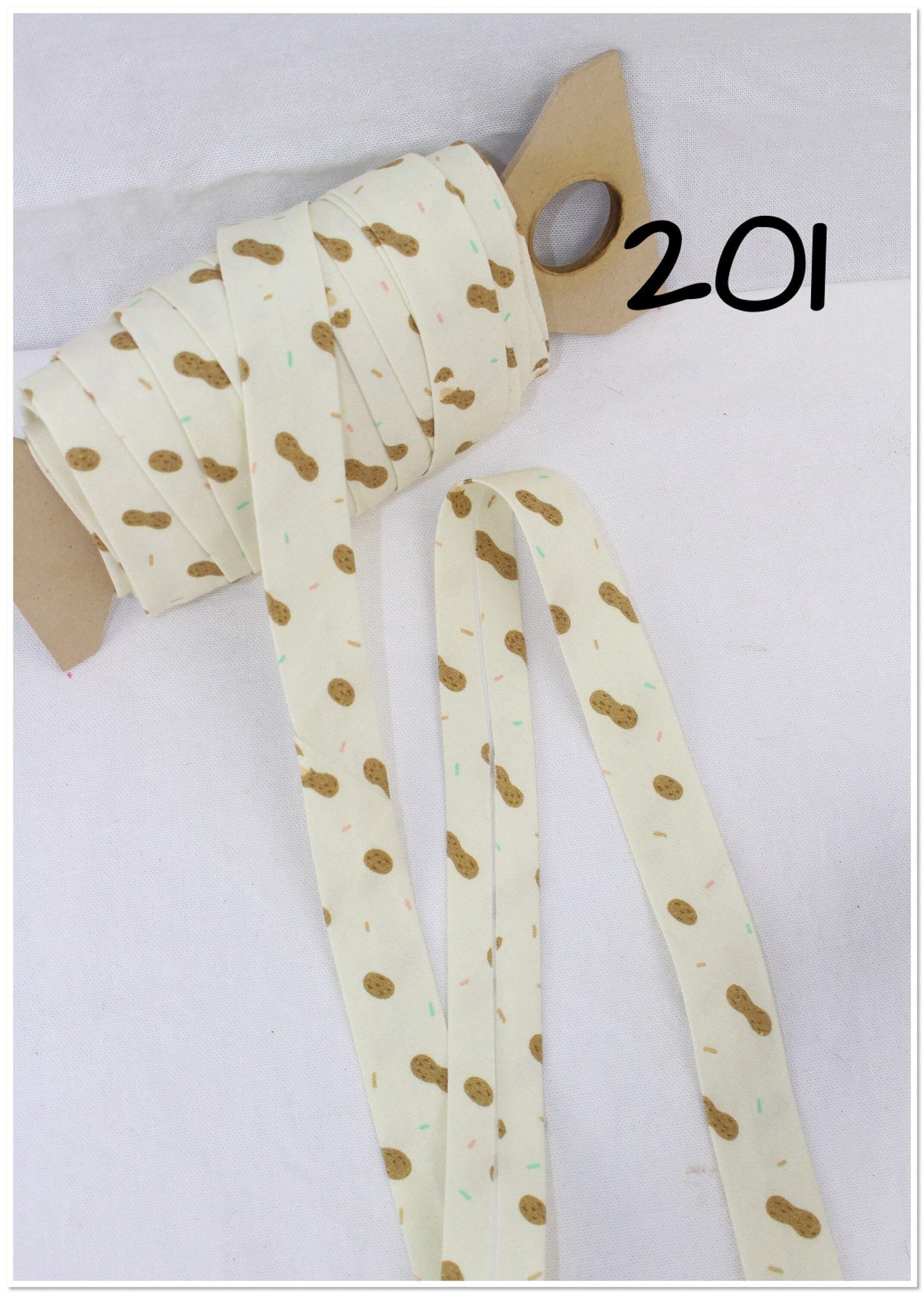 Bias Binding (Tape) 25mm, Cotton, Single Fold, peanuts, animal print, crosses, triangles. Fusible iron on available.