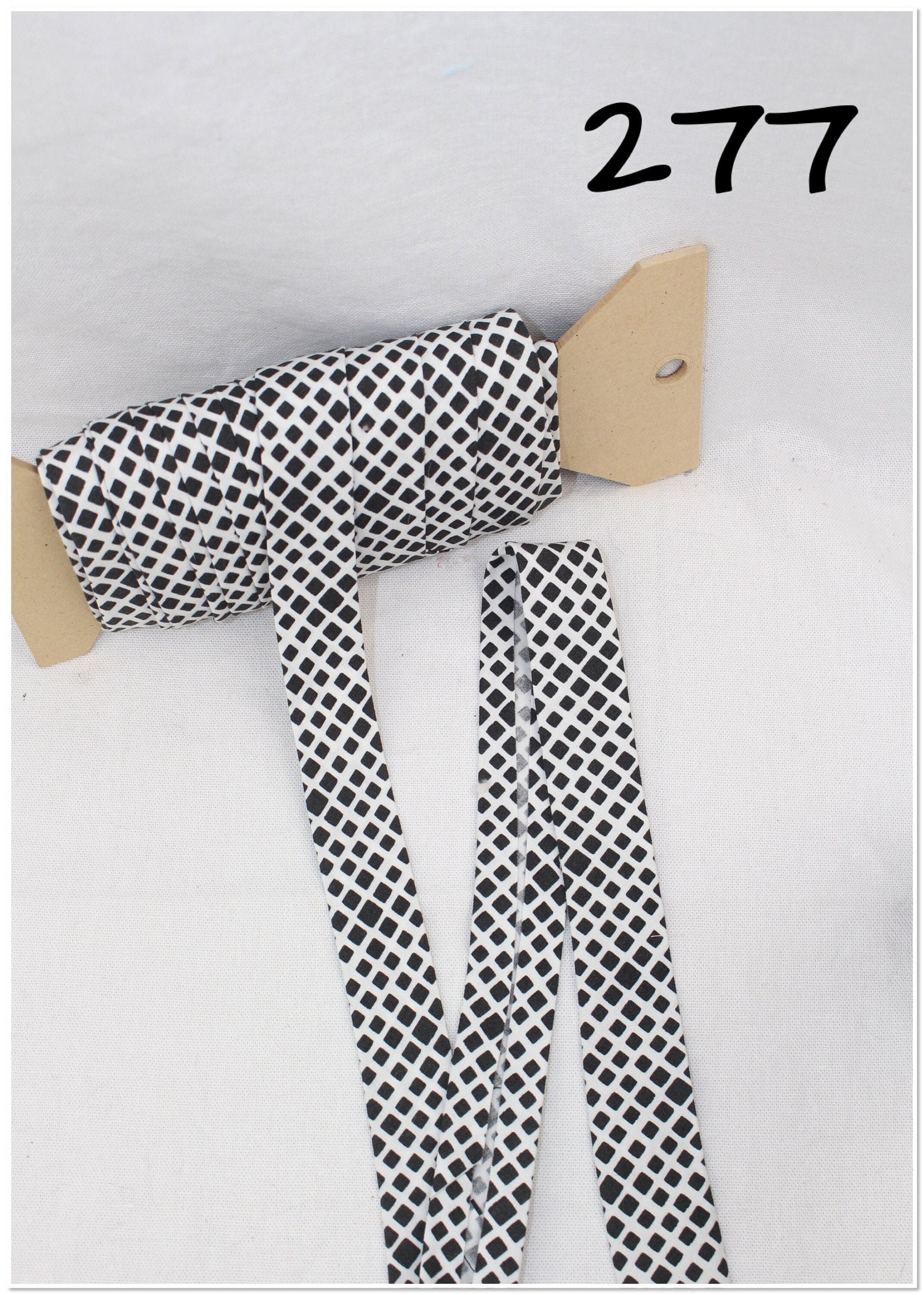 Bias Binding (Tape) 25mm, Cotton, Single Fold. Fusible iron on available. black and white/ paisley.