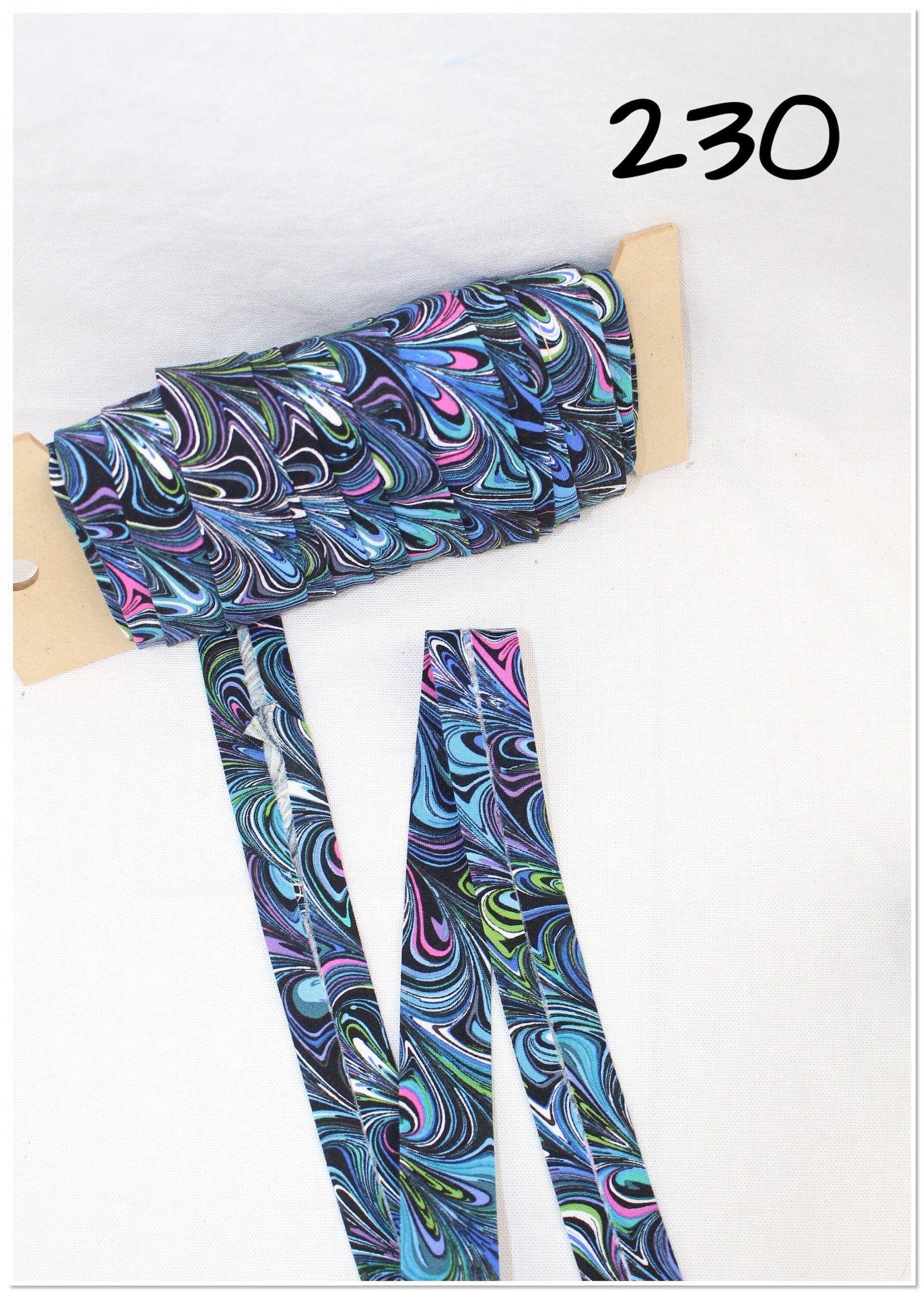 Bias Binding (Tape) 25mm, Cotton, Single Fold, swirls purple, green, blue. Fusible iron on available.