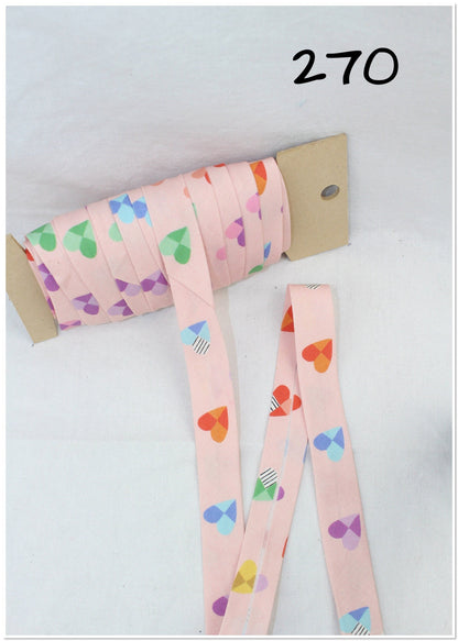 Bias Binding (Tape) 25mm, Cotton, Single Fold, red pattern, hearts. Fusible iron on available.