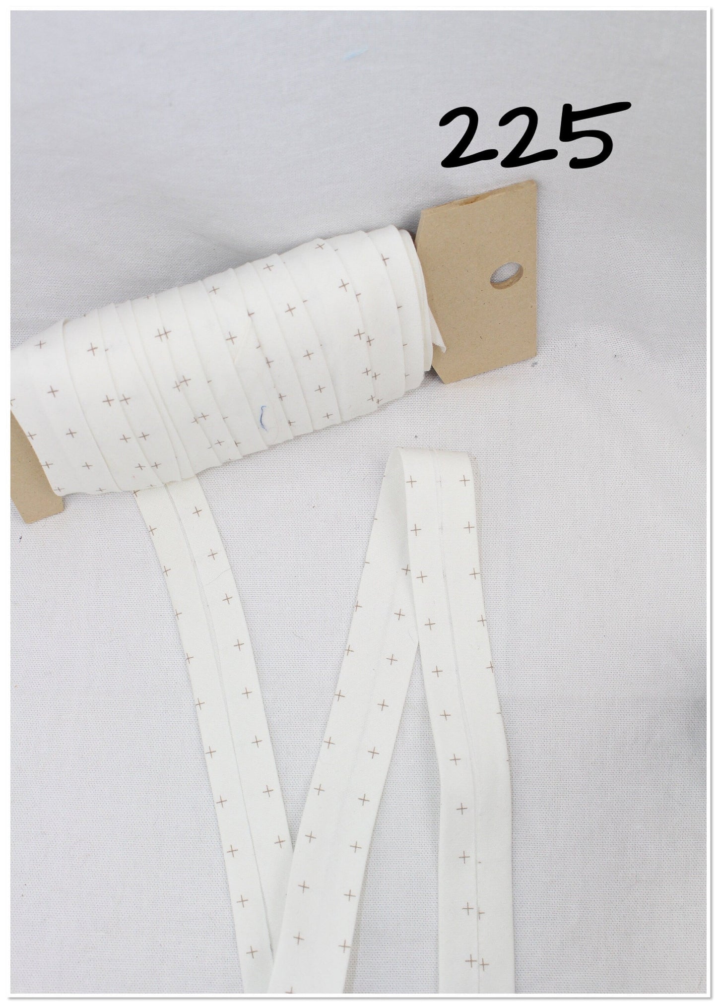 Bias Binding (Tape) 25mm, Cotton, Single Fold, white and crosses. Fusible iron on available.