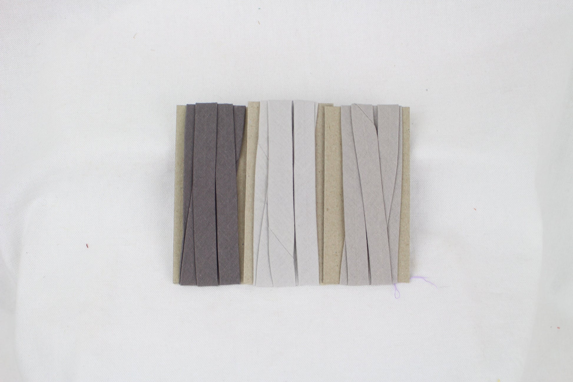 Bias Binding (tape) 12mm, single fold. Neutral grey, iron, light grey. Fusible iron on available. 100% Cotton