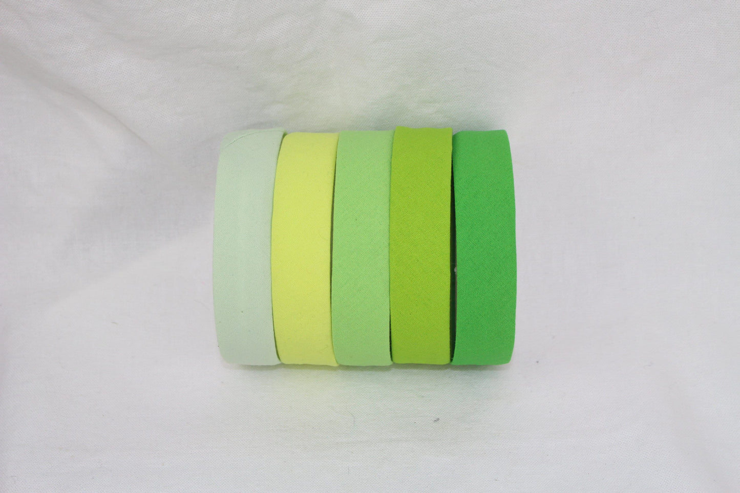 Bias Binding (tape) 25mm, single fold, tea green, apple, lime green, spearmint. Fusible iron on available. 100% cotton