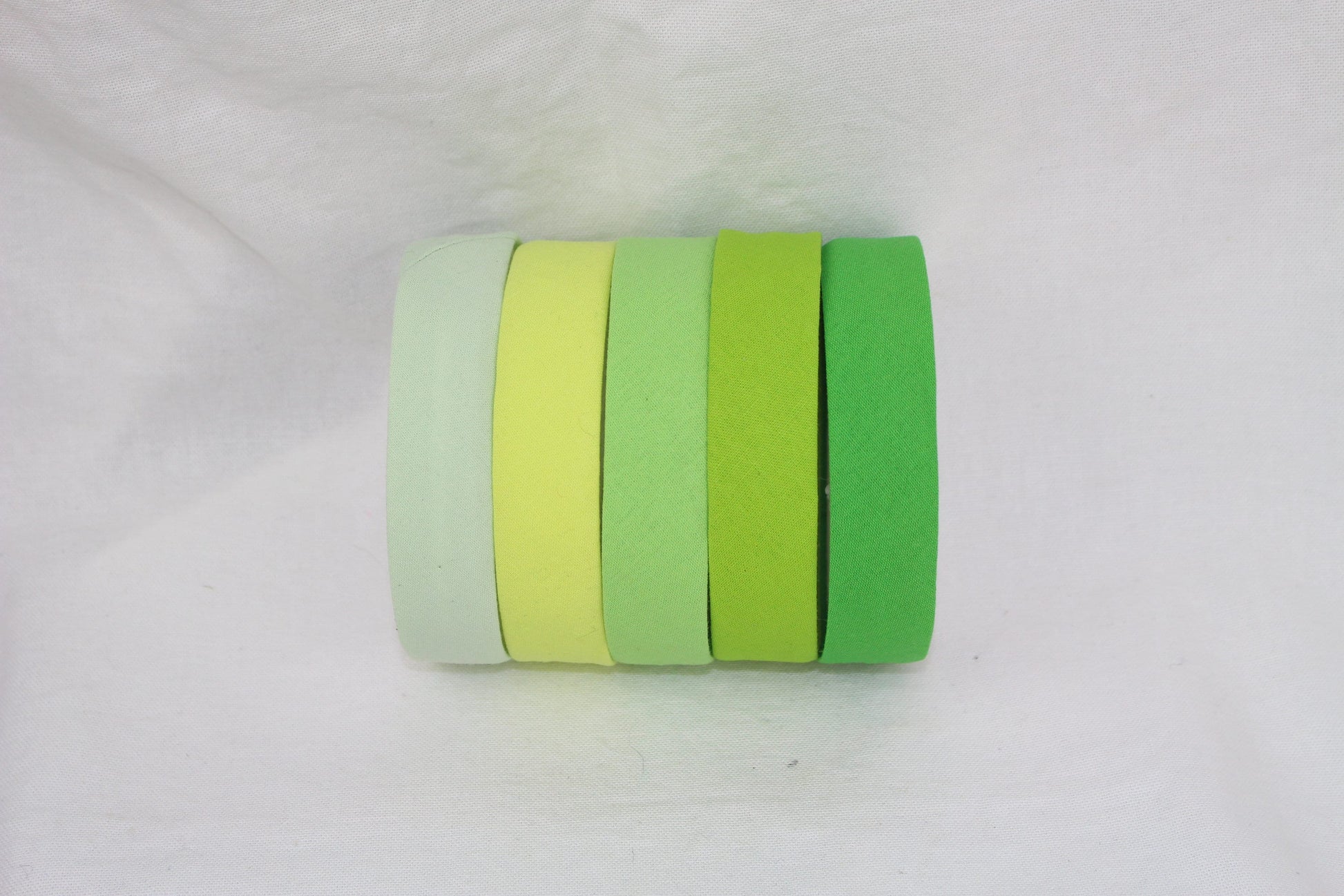 Bias Binding (tape) 25mm, single fold, tea green, apple, lime green, spearmint. Fusible iron on available. 100% cotton