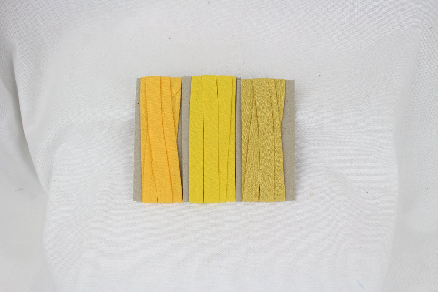 Bias Binding (tape) 12mm, single fold. mustard, aussie gold, lemon chrome. Fusible iron on.